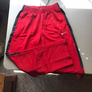 Red Nike warmup sweatpants